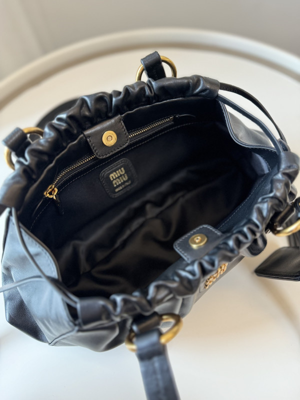 M*um*u joie nappa leather bag